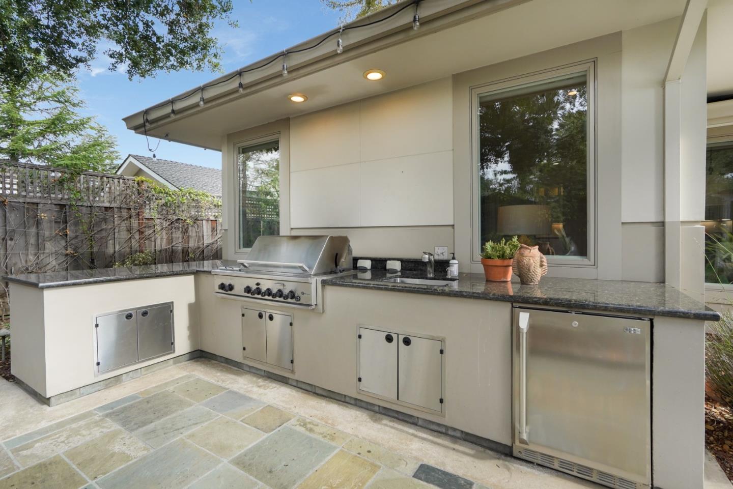 196 Merritt Road Los Altos, CA 94022 - Photo 43 of 46 a kitchen with granite countertop a sink and white cabinets