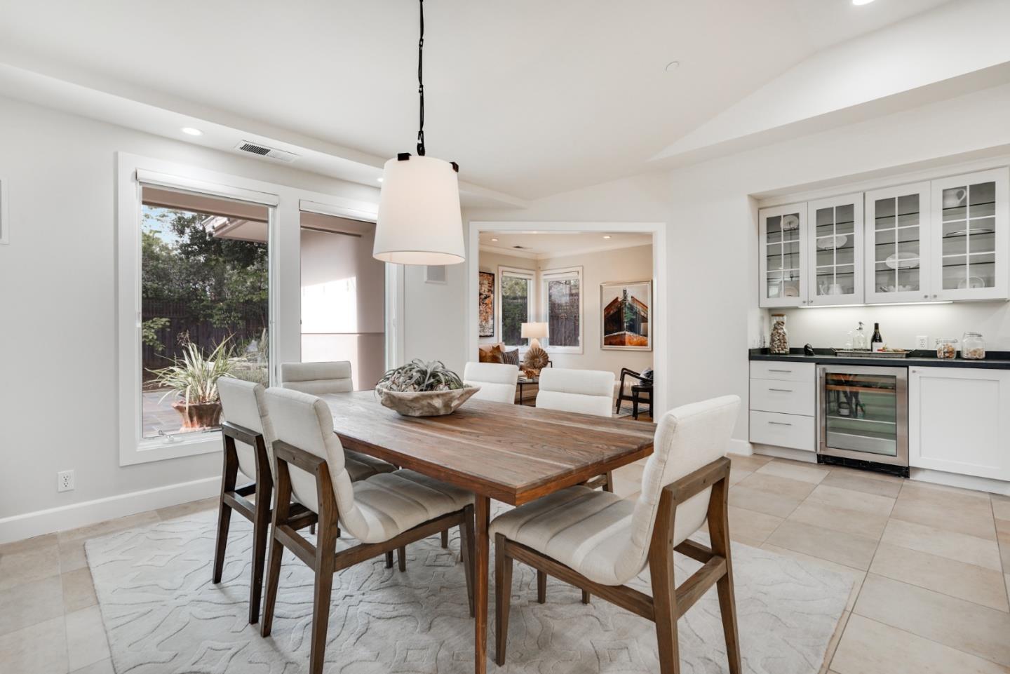196 Merritt Road Los Altos, CA 94022 - Photo 8 of 46 a view of a dining room and livingroom with furniture wooden floor a chandelier