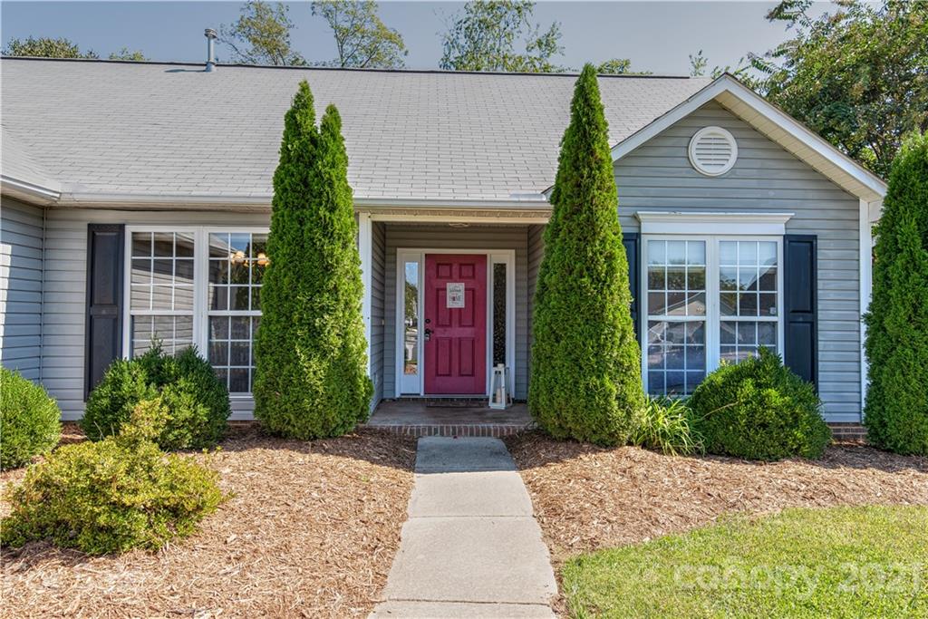461 Planters Creek Road Fletcher, NC 28732 - Photo 2 of 26 a front view of a house with garden