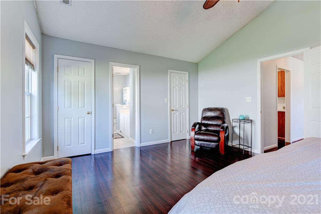461 Planters Creek Road Fletcher, NC 28732 - Photo 13 of 26 a bedroom with furniture and a wooden floor