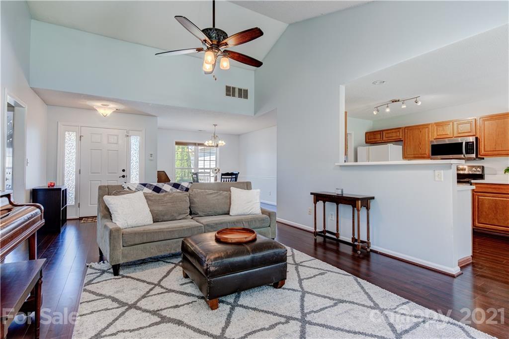 461 Planters Creek Road Fletcher, NC 28732 - Photo 3 of 26 a living room with furniture and a flat screen tv