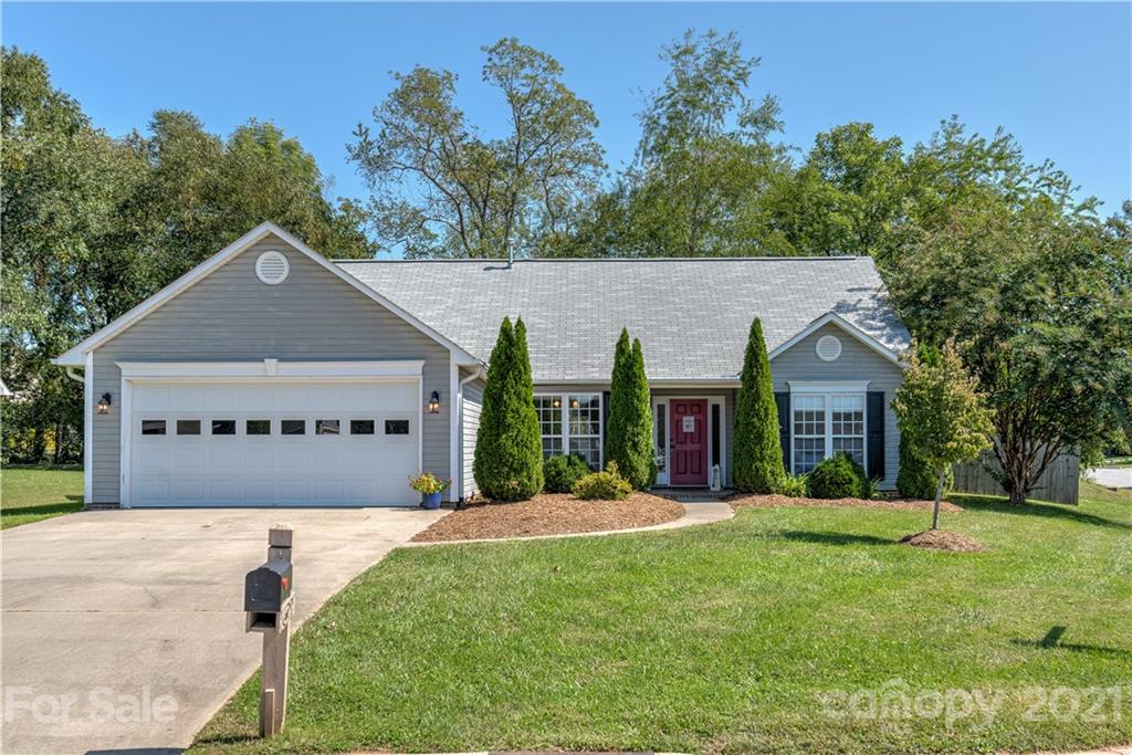 461 Planters Creek Road Fletcher, NC 28732 - Photo 26 of 26 a view of a white house with a big yard and potted plants in front of it