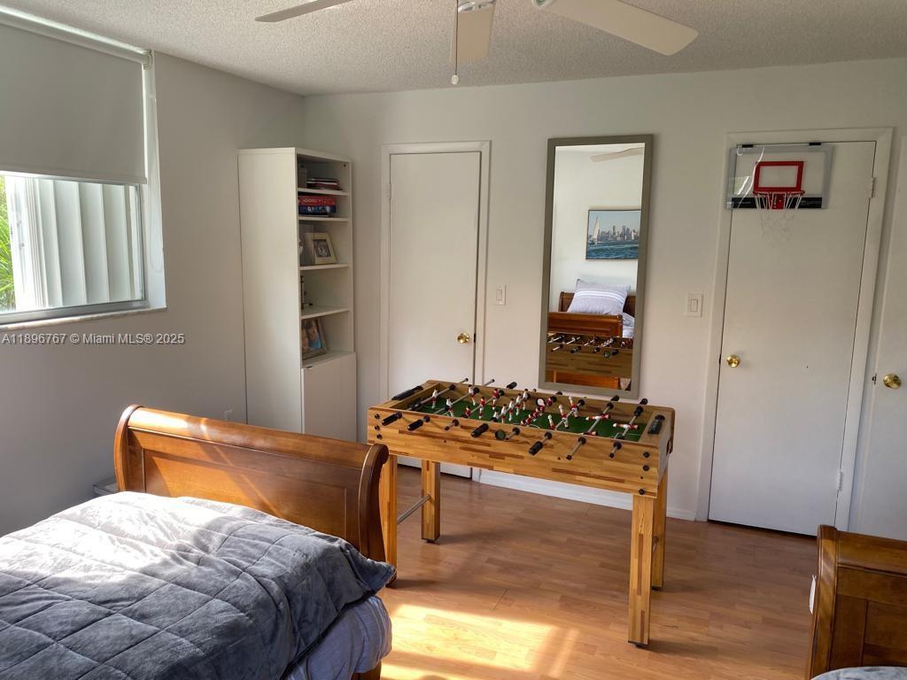 210 Seaview Drive, Unit 312 Key Biscayne, FL 33149 - Photo 14 of 26 a bedroom with a bed and a dresser