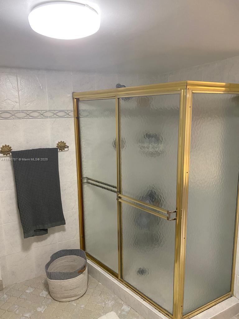 210 Seaview Drive, Unit 312 Key Biscayne, FL 33149 - Photo 25 of 26 a bathroom with a shower
