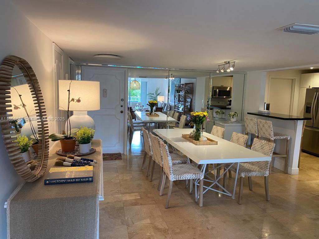 210 Seaview Drive, Unit 312 Key Biscayne, FL 33149 - Photo 5 of 26 a view of a dining room with furniture