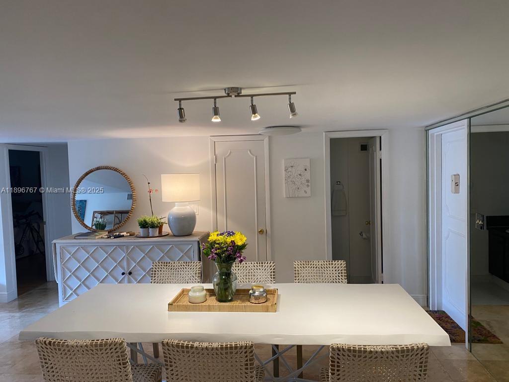 210 Seaview Drive, Unit 312 Key Biscayne, FL 33149 - Photo 7 of 26 a bedroom with a bed and couch