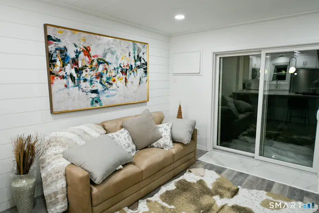 a living room with furniture and window