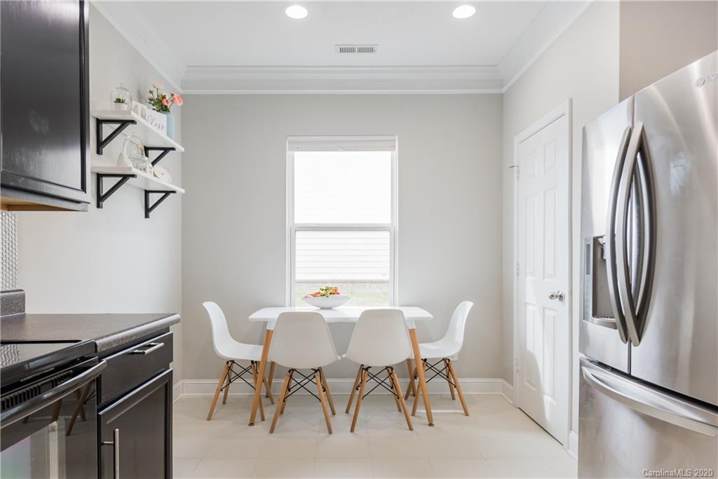 4002 Farm Pond Road Indian Trail, NC 28079 - Photo 15 of 32 a view of a dining room with furniture