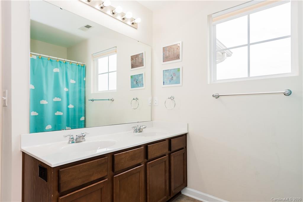 4002 Farm Pond Road Indian Trail, NC 28079 - Photo 23 of 32 a bathroom with a sink and a mirror