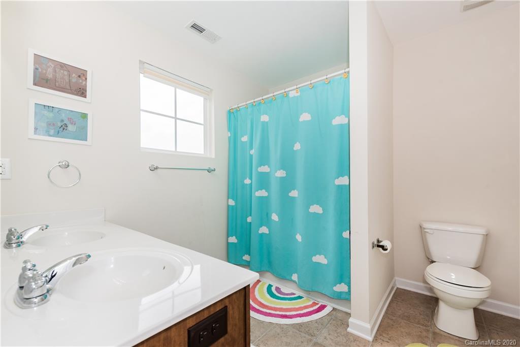 4002 Farm Pond Road Indian Trail, NC 28079 - Photo 24 of 32 a bathroom with a sink a toilet and shower