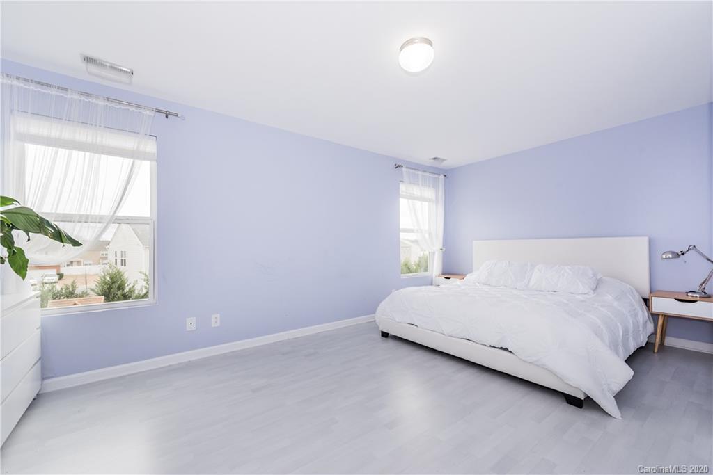 4002 Farm Pond Road Indian Trail, NC 28079 - Photo 25 of 32 a spacious bedroom with a bed and a window