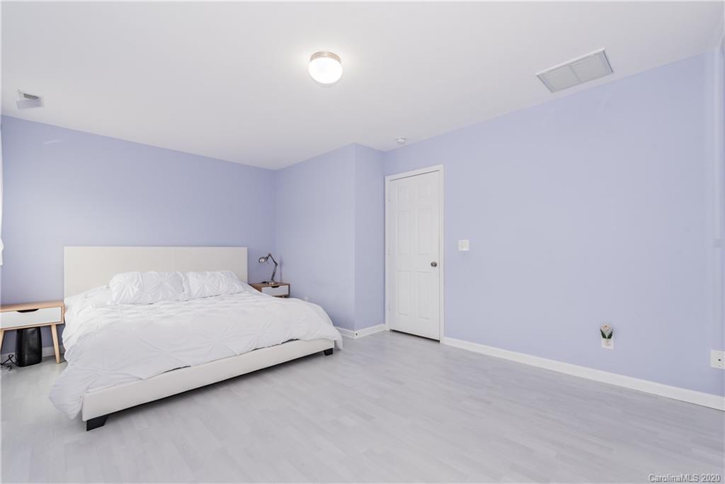 4002 Farm Pond Road Indian Trail, NC 28079 - Photo 26 of 32 a bedroom with a bed and a night stand