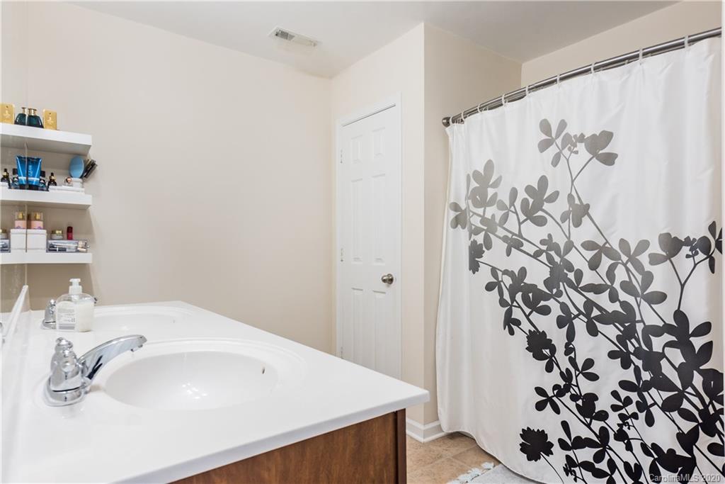 4002 Farm Pond Road Indian Trail, NC 28079 - Photo 28 of 32 a bathroom with a sink and a mirror