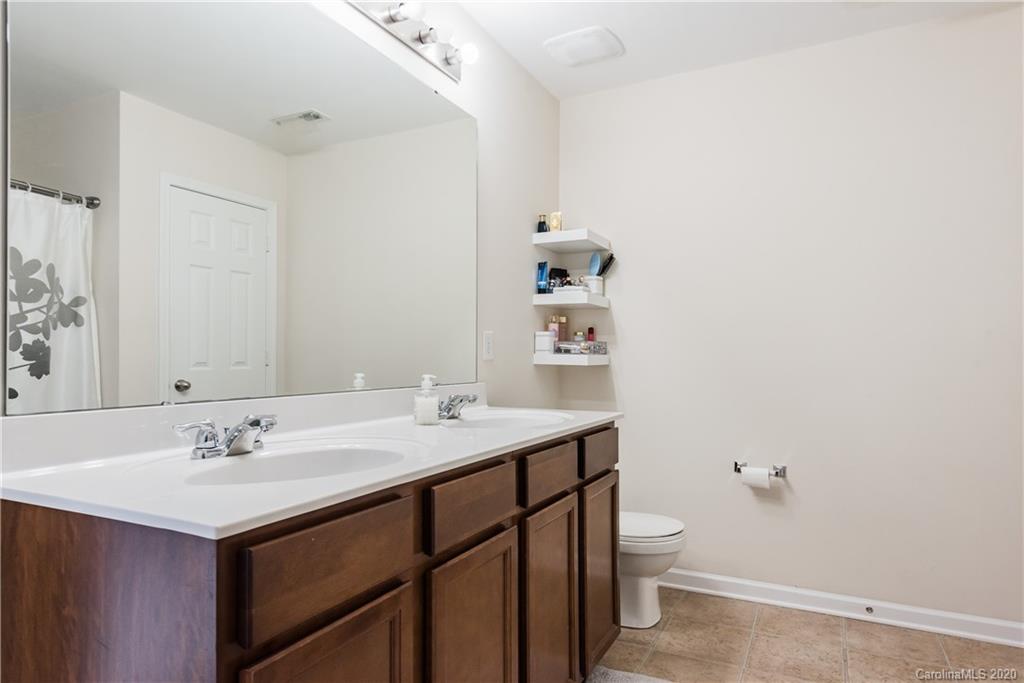 4002 Farm Pond Road Indian Trail, NC 28079 - Photo 29 of 32 a bathroom with a sink vanity and a toilet