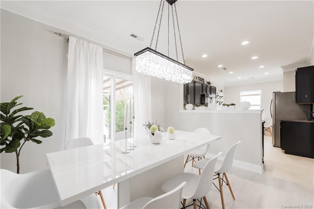 4002 Farm Pond Road Indian Trail, NC 28079 - Photo 10 of 32 a dining room filled chandelier and kitchen view
