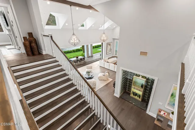a view of living room with furniture and a fireplace