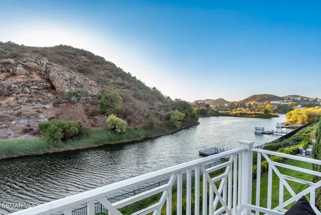 a view of a lake from a balcony