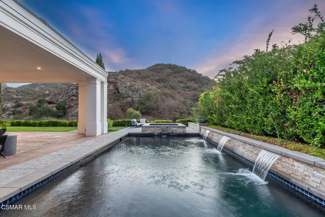 a view of a street with a large trees