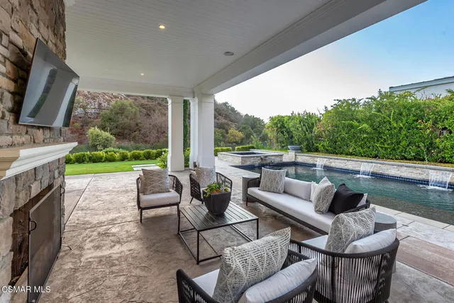 a view of a garden with mountain view in front of it
