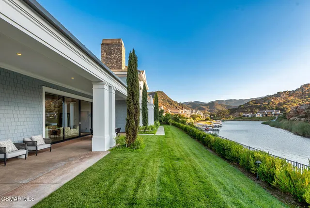 a view of a terrace with a lake view