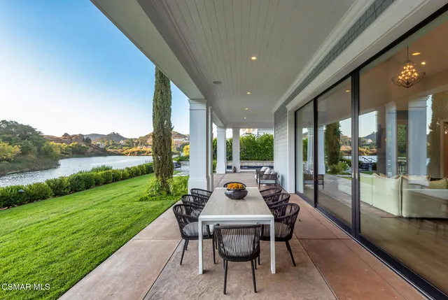 a view of a big building with a mountain in the background