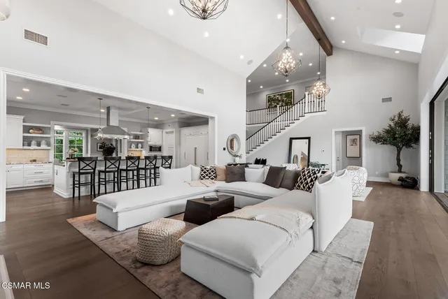 a living room with furniture and a table