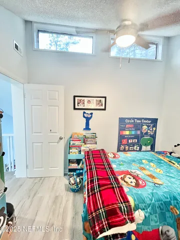 a room that has a bed and a table in it