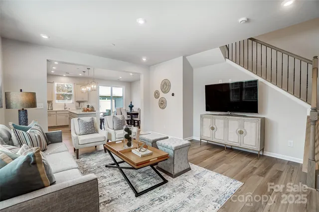 a living room with furniture fireplace and a flat screen tv