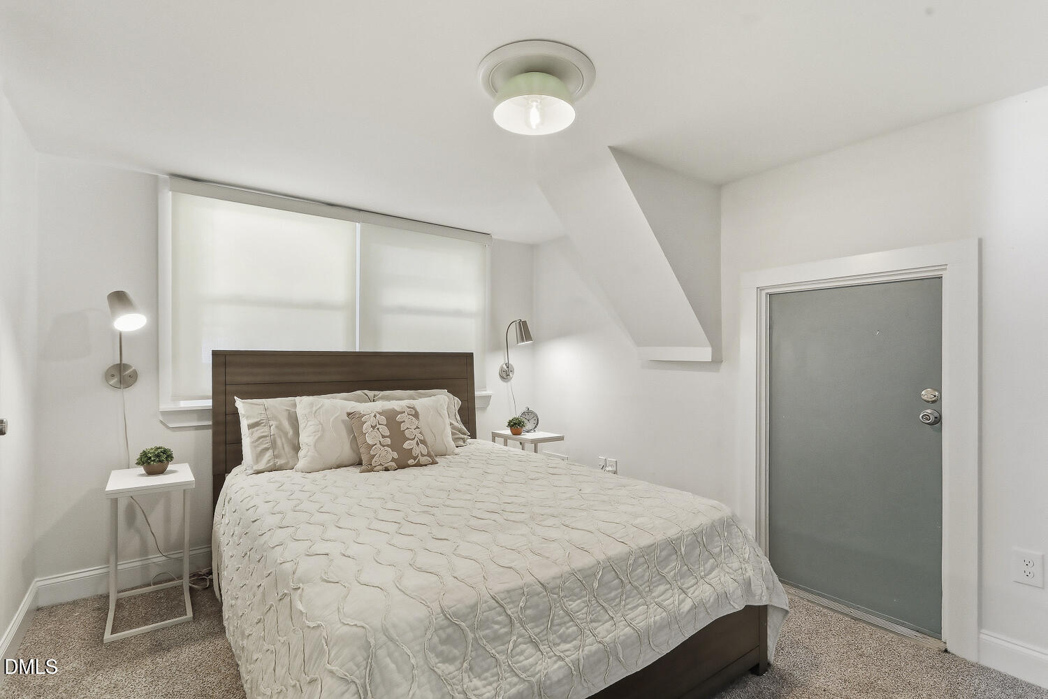 3704 Swann Street Raleigh, NC 27612 - Photo 16 of 21 a bedroom with a bed and a window