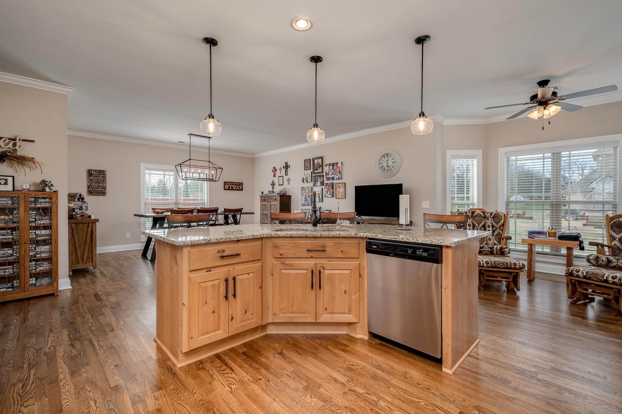 4306 Singleton Drive Murfreesboro, TN 37127 - Photo 16 of 34 a open kitchen with stainless steel appliances granite countertop a stove and white cabinets with wooden floor