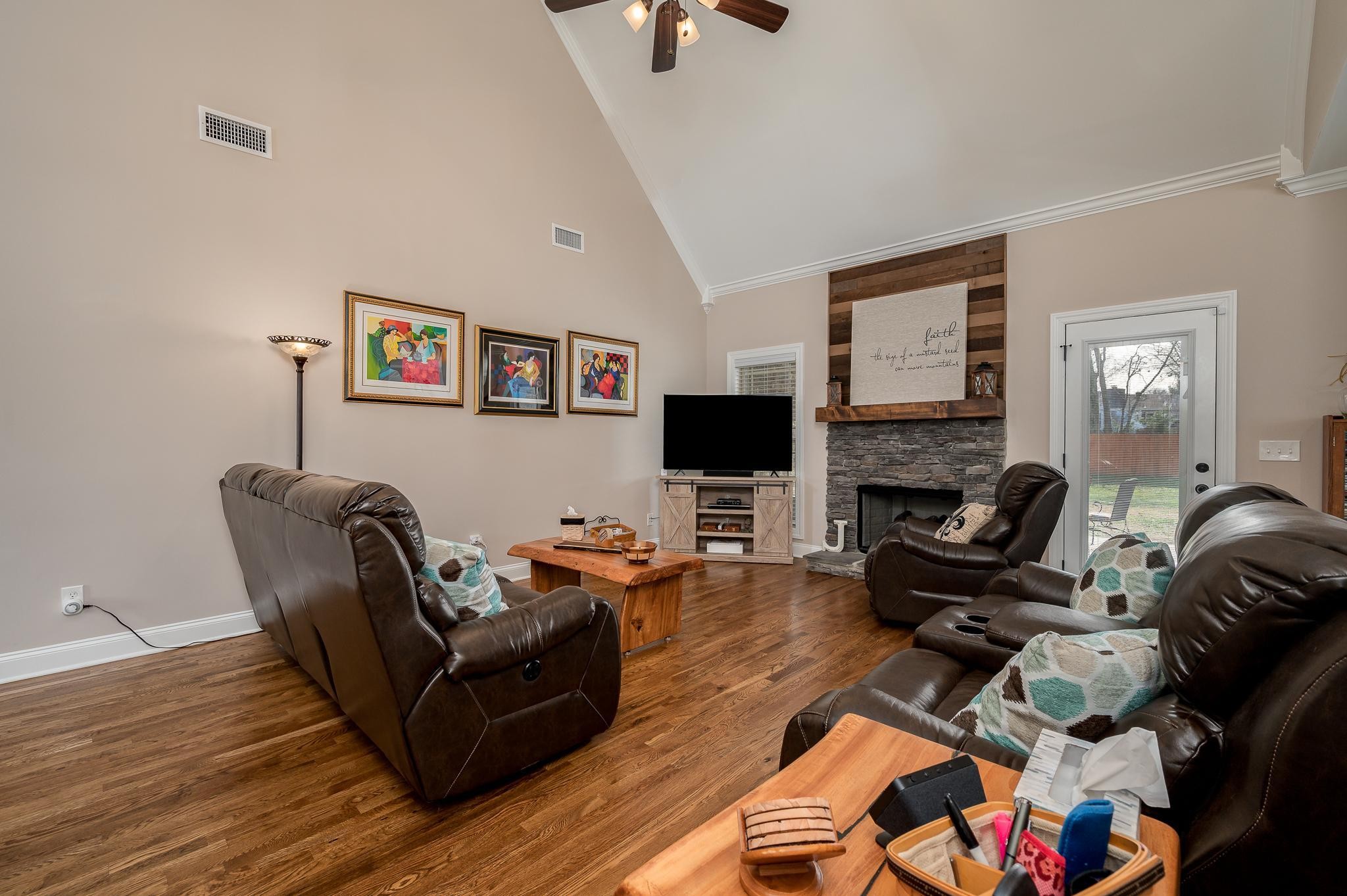 4306 Singleton Drive Murfreesboro, TN 37127 - Photo 6 of 34 a living room with furniture and a flat screen tv