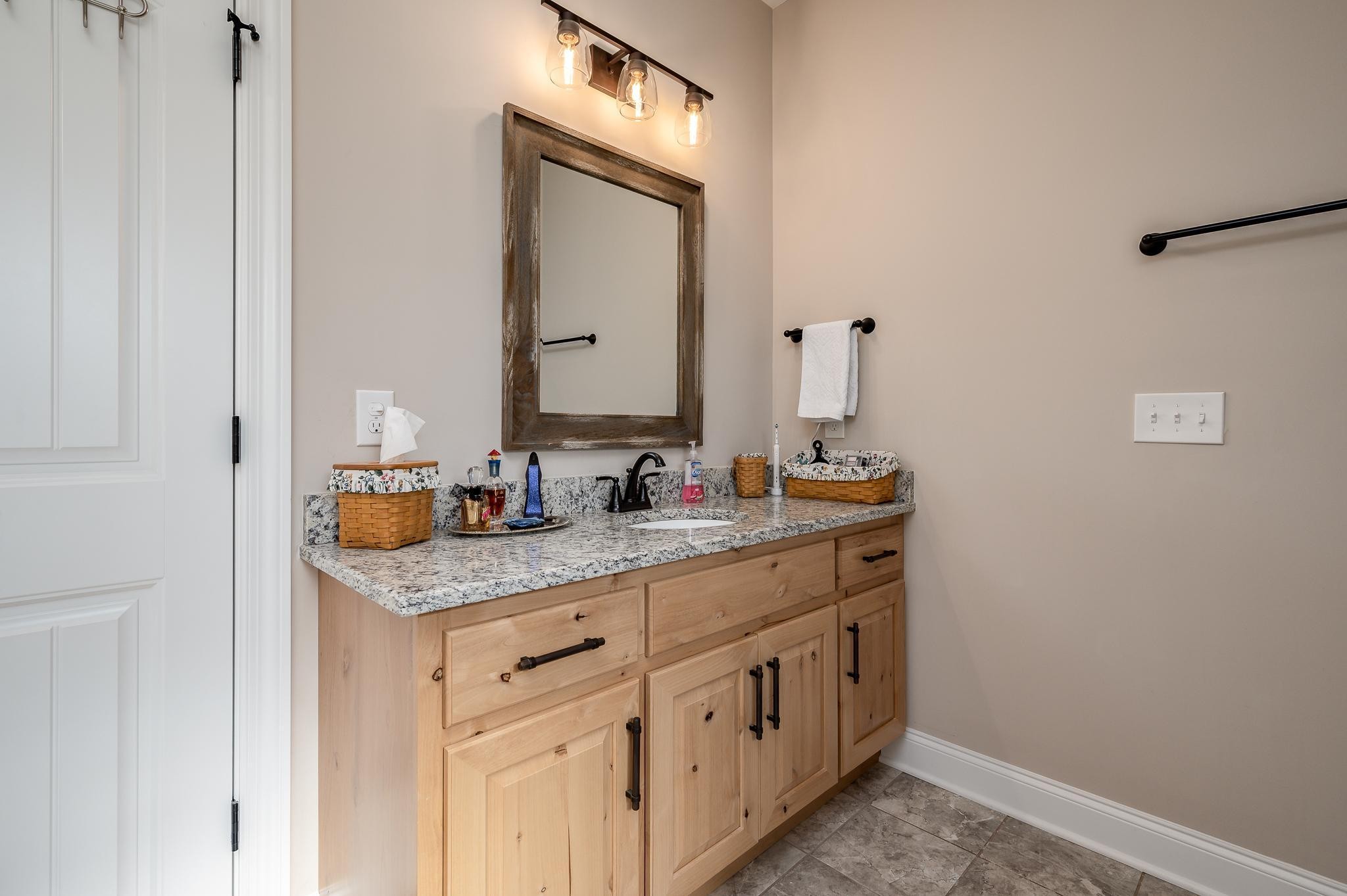4306 Singleton Drive Murfreesboro, TN 37127 - Photo 10 of 34 a bathroom with a sink and a mirror