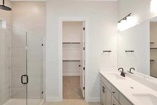 a bathroom with a shower and a sink