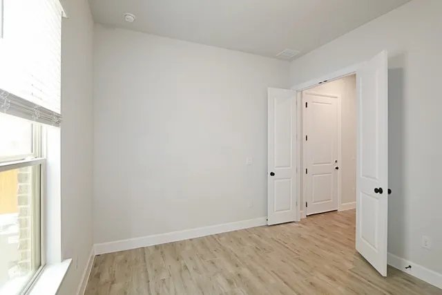 a bathroom with a double vanity sink mirror and shower
