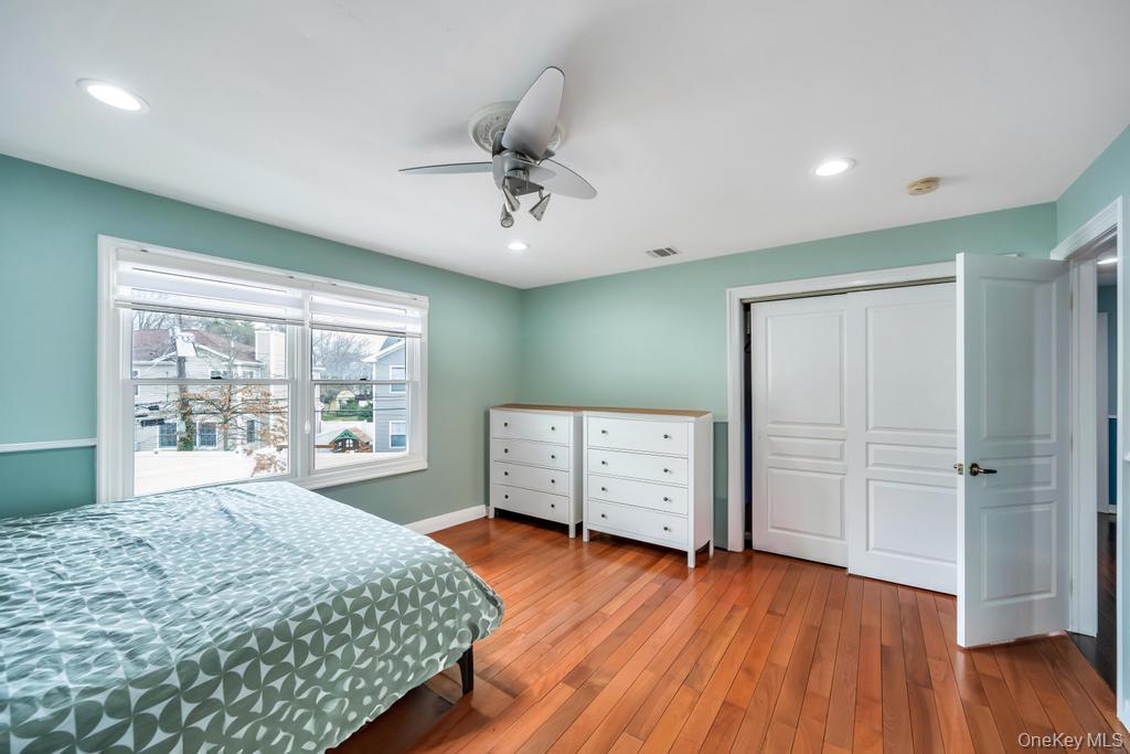 6 Garden Circle Syosset, NY 11791 - Photo 15 of 29 a bedroom with furniture and windows