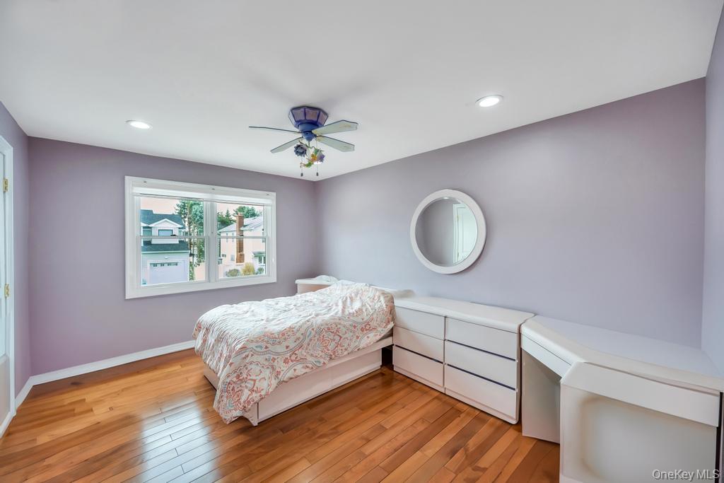 6 Garden Circle Syosset, NY 11791 - Photo 18 of 29 a bed room with a bed and a window