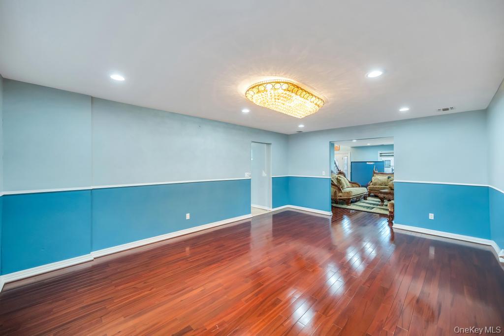 6 Garden Circle Syosset, NY 11791 - Photo 26 of 29 a view of a room with wooden floor and furniture