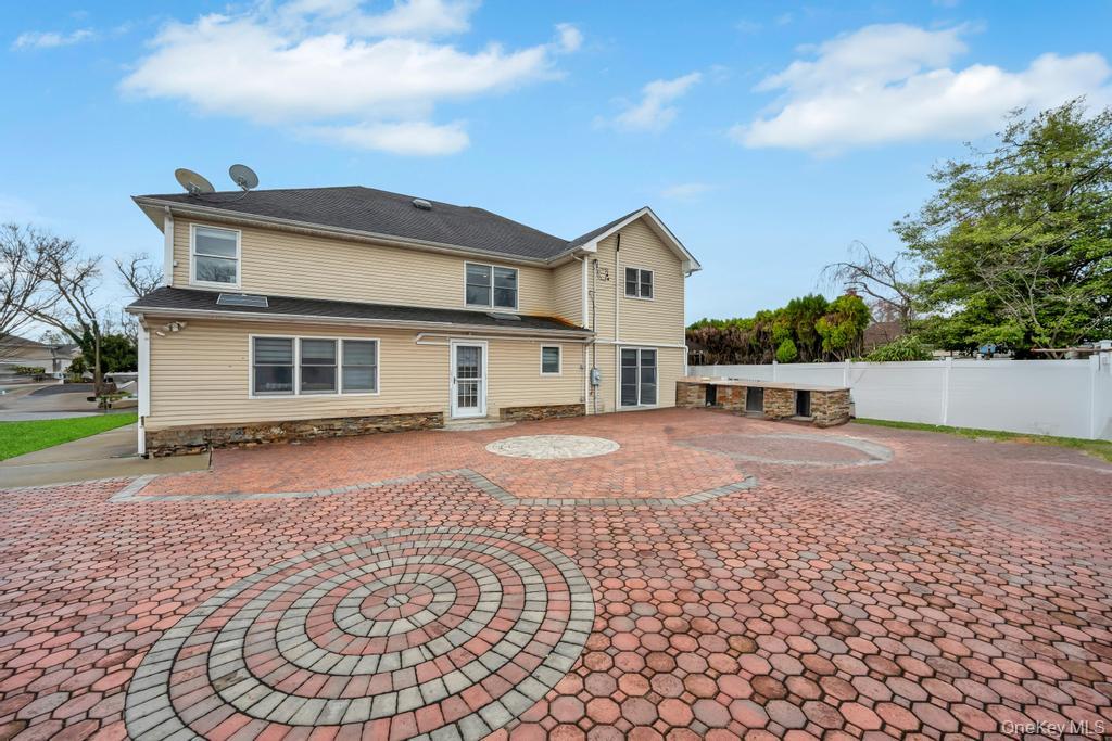 6 Garden Circle Syosset, NY 11791 - Photo 27 of 29 a front view of a house with a yard
