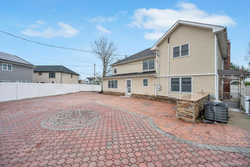 6 Garden Circle Syosset, NY 11791 - Photo 29 of 29 a front view of a house with a yard