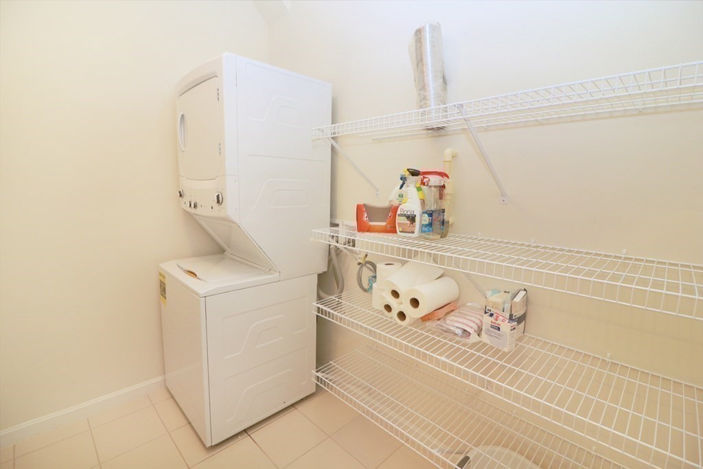 7 Morgan Drive, Unit 104 Natick, MA 01760 - Photo 15 of 26 a utility room with dryer and washer