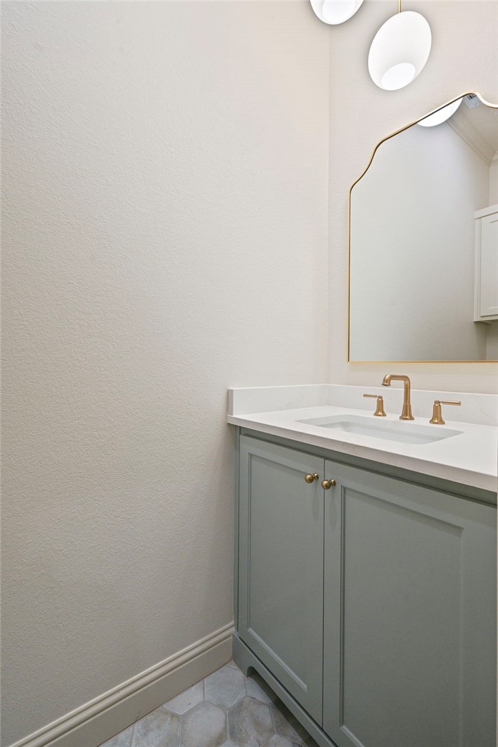 7052 Skipping Rock Path Bryan, TX 77808 - Photo 21 of 23 a bathroom with a sink and a mirror