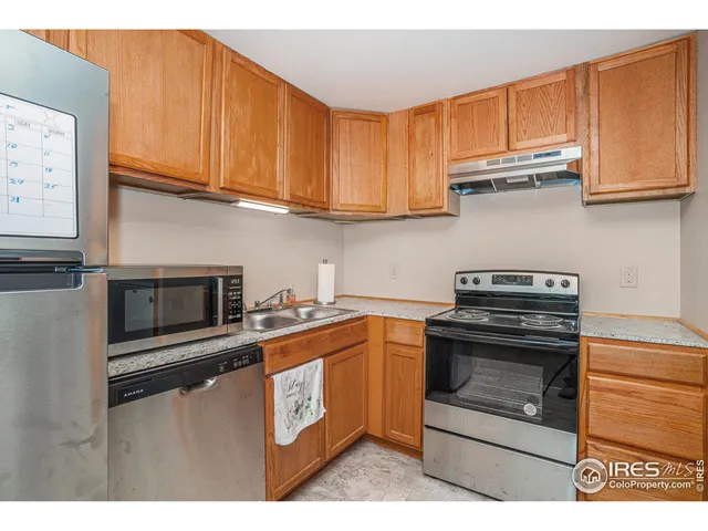 a view of empty room with a fireplace