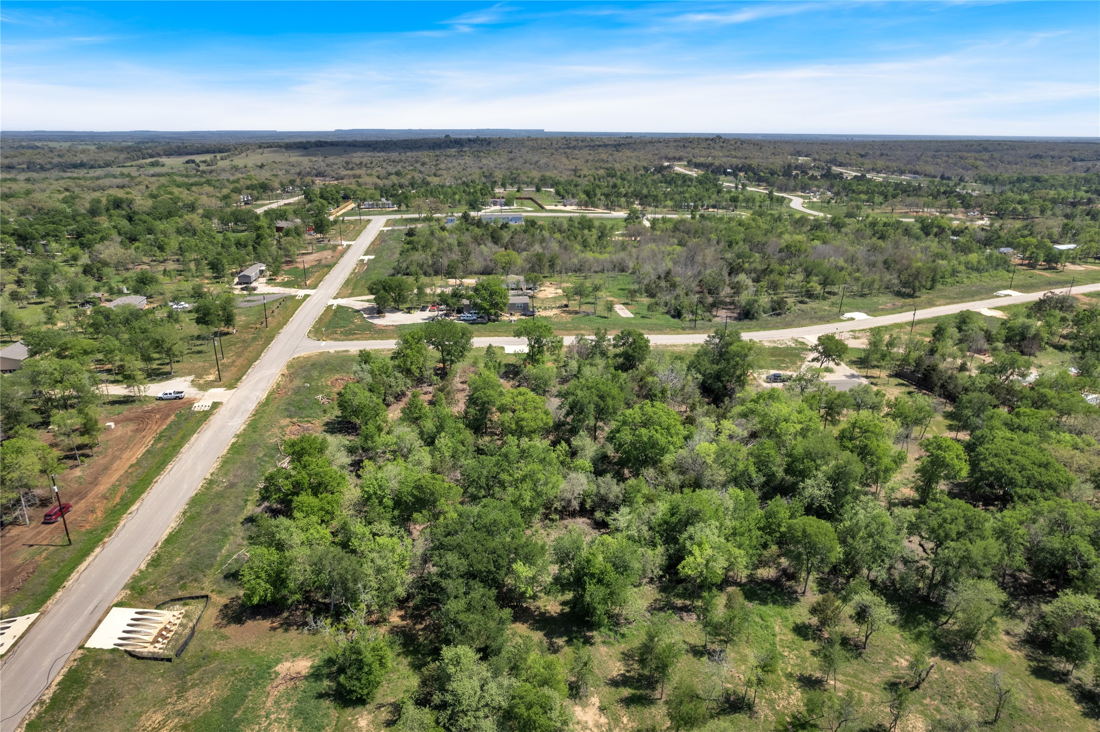 112 Empire Street Elgin, TX 78621 - Photo 9 of 22 Drone / aerial view with a view of trees