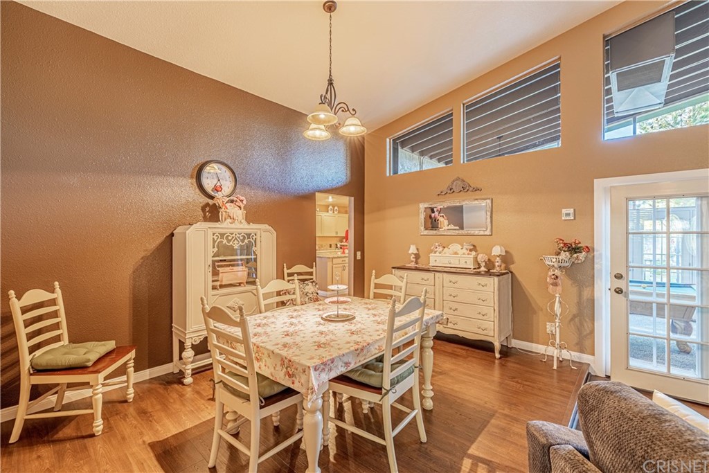 2701 West Ave J4 Lancaster, CA 93536 - Photo 11 of 46 a view of a dining room with furniture window and wooden floor