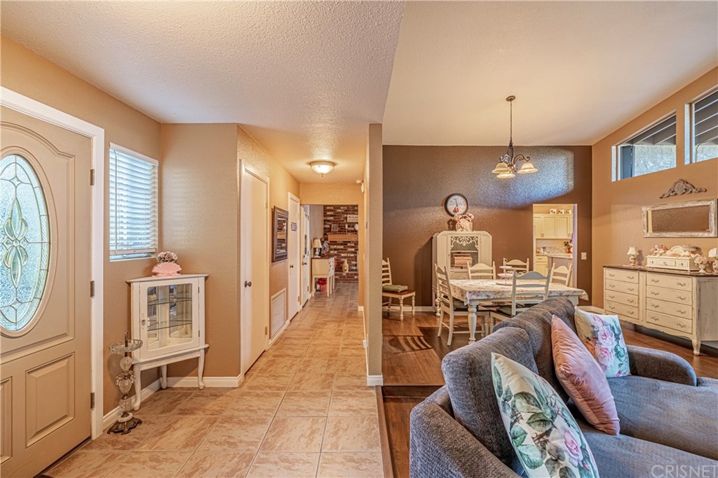 2701 West Ave J4 Lancaster, CA 93536 - Photo 13 of 46 a view of a livingroom with furniture and a chandelier