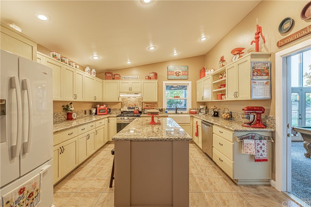 2701 West Ave J4 Lancaster, CA 93536 - Photo 17 of 46 a large kitchen with stainless steel appliances lots of counter space and a sink