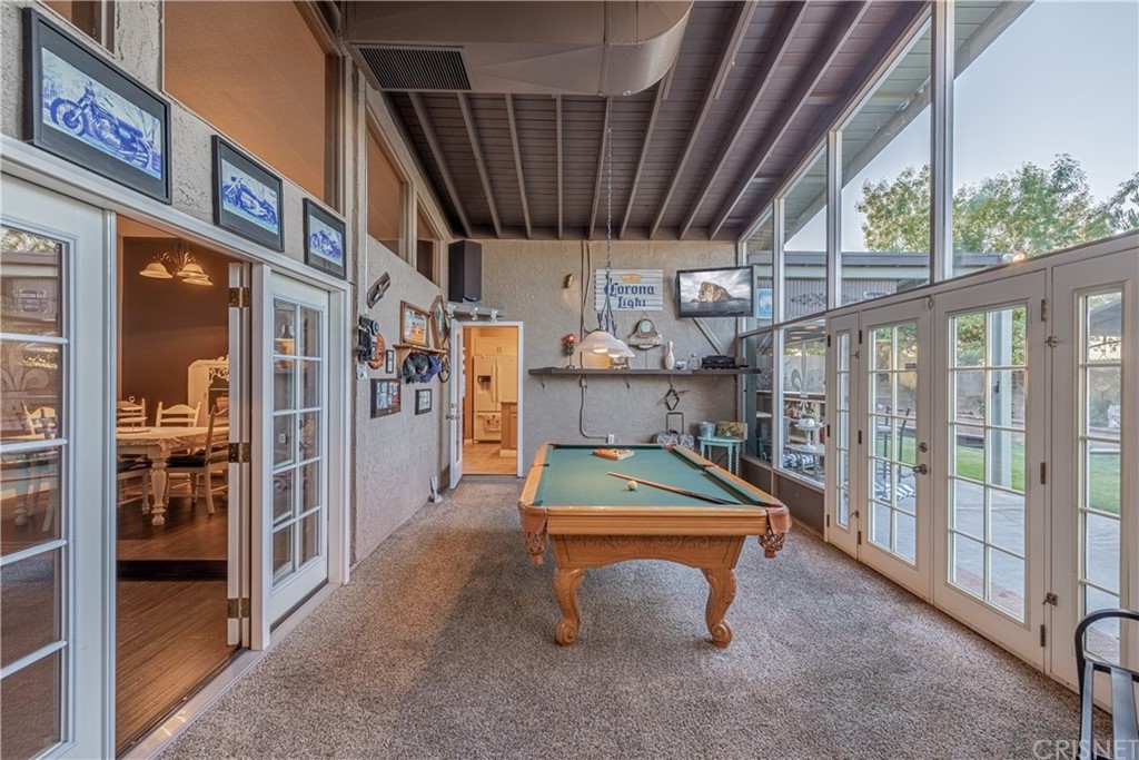 2701 West Ave J4 Lancaster, CA 93536 - Photo 20 of 46 a room with lots of furniture and windows