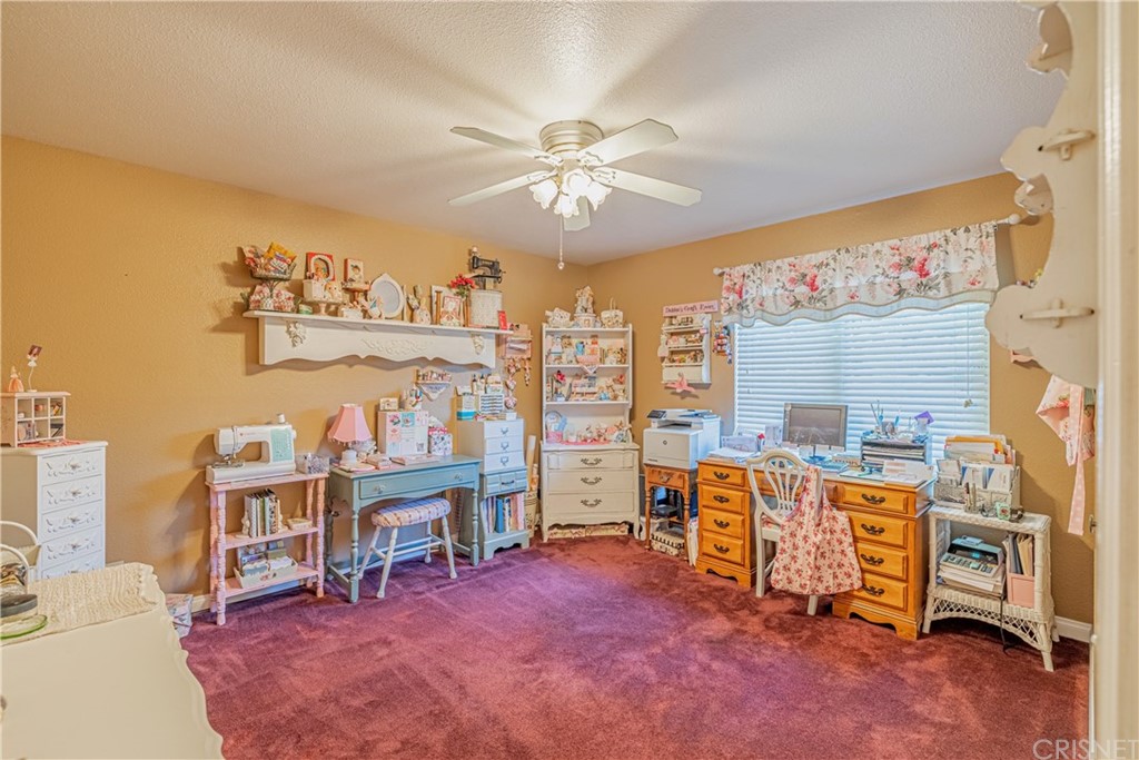 2701 West Ave J4 Lancaster, CA 93536 - Photo 23 of 46 a view of a livingroom with furniture and a ceiling fan