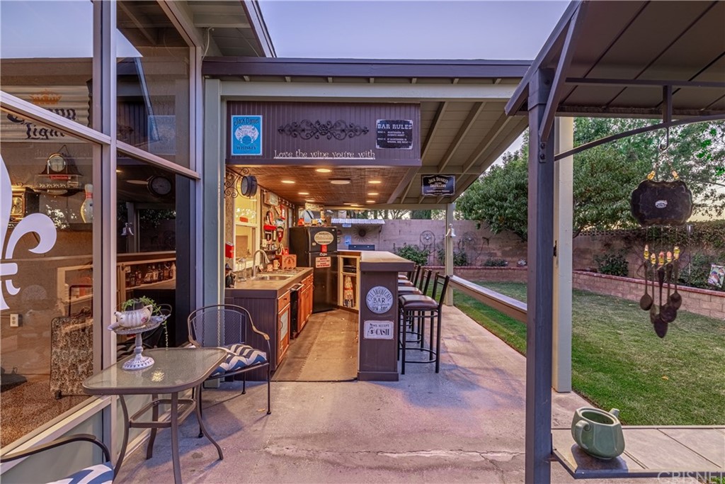 2701 West Ave J4 Lancaster, CA 93536 - Photo 3 of 46 a view of a porch with chairs and backyard