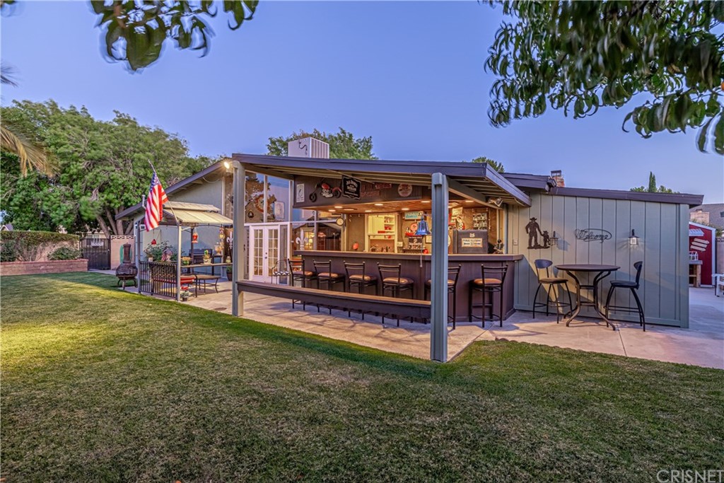 2701 West Ave J4 Lancaster, CA 93536 - Photo 40 of 46 a view of a house with a yard porch and sitting area